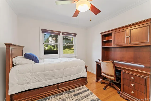 a bedroom with a bed and cabinets