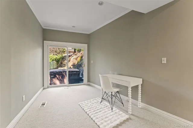 a living room with furniture a rug and a table