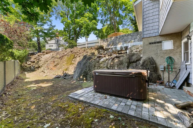 a view of backyard with outdoor seating