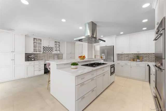 a kitchen with a stove a sink and a refrigerator