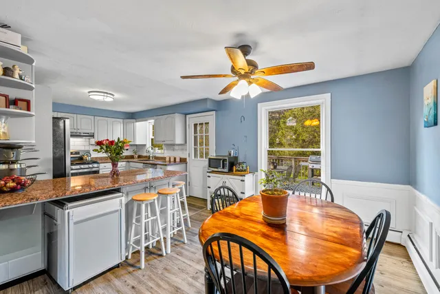 a view of a dining room with furniture window and outside view