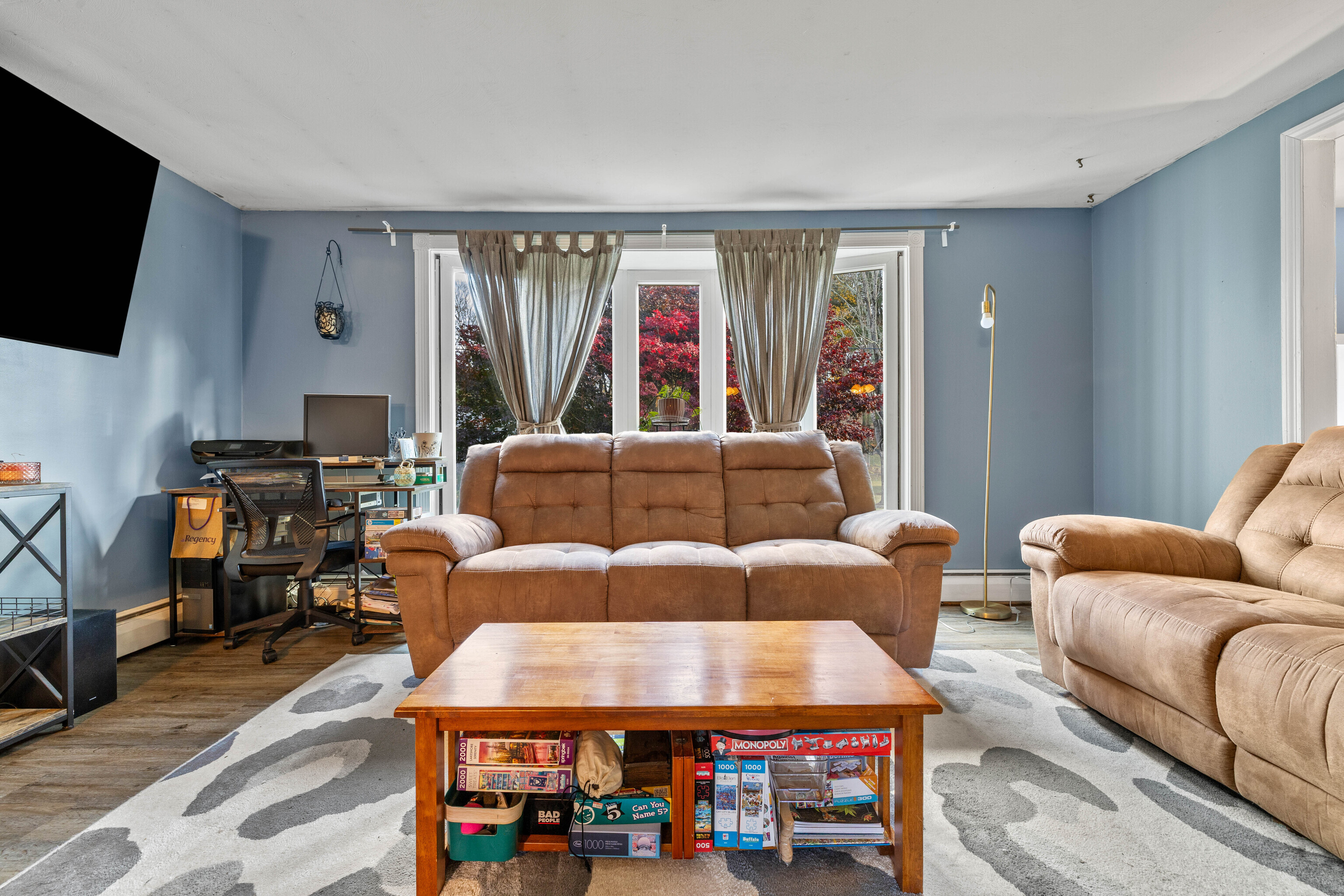 4 Van Dyke Lane Clinton, CT 06413 - Photo 16 of 38 a living room with furniture a flat screen tv and a window