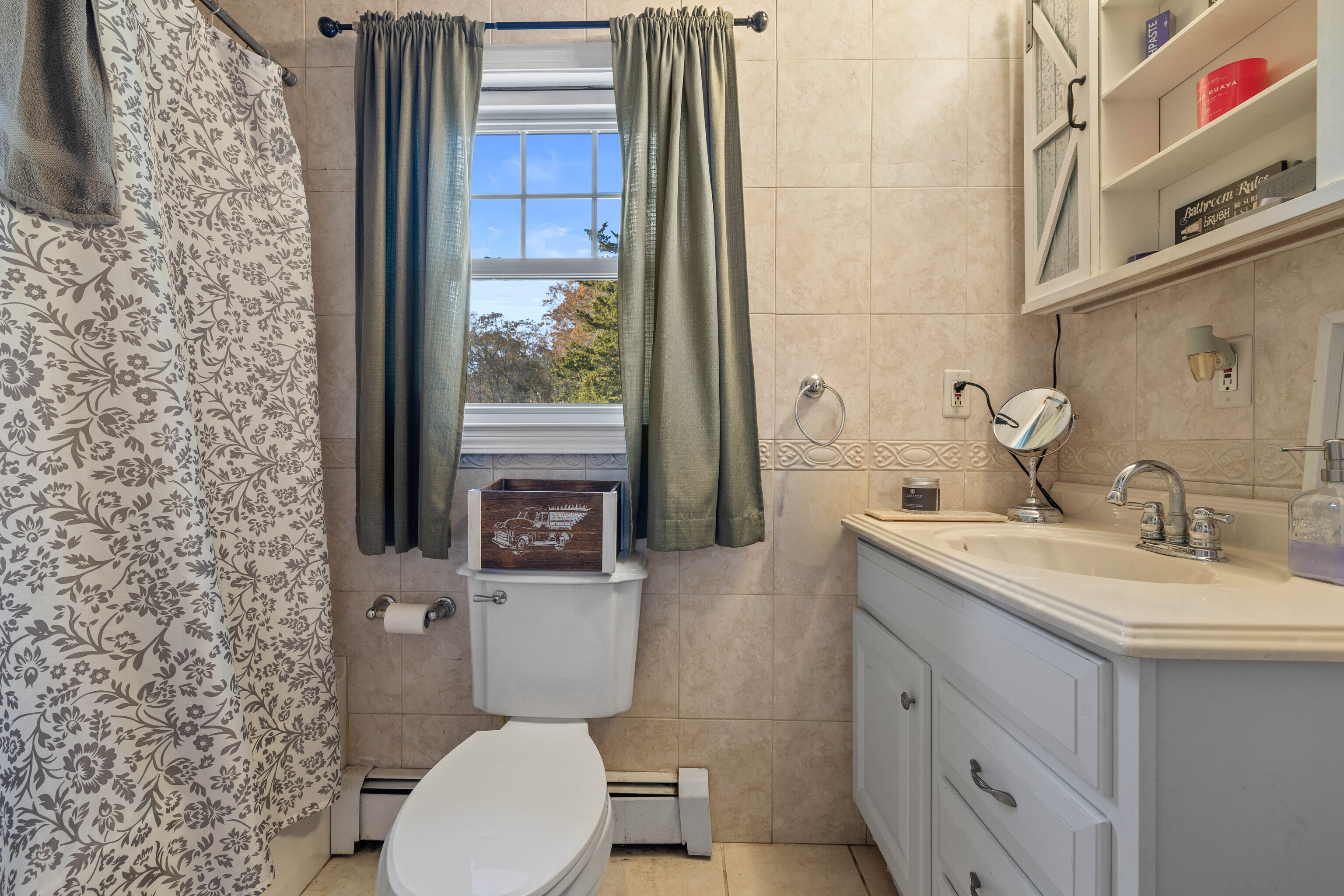 4 Van Dyke Lane Clinton, CT 06413 - Photo 17 of 38 a bathroom with a toilet sink and mirror