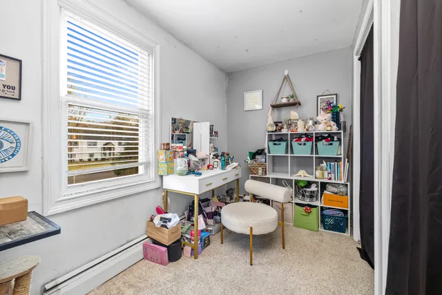 a room with furniture and a window