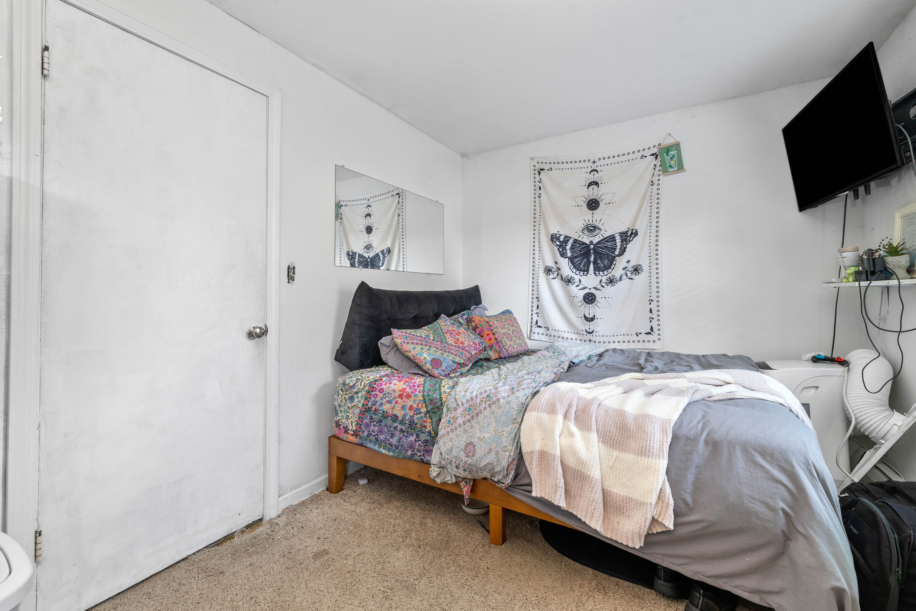 4 Van Dyke Lane Clinton, CT 06413 - Photo 23 of 38 a bedroom with a bed and a flat screen tv