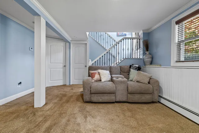a living room with furniture and windows