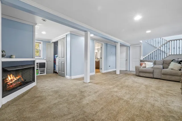 a view of livingroom with furniture and a fireplace