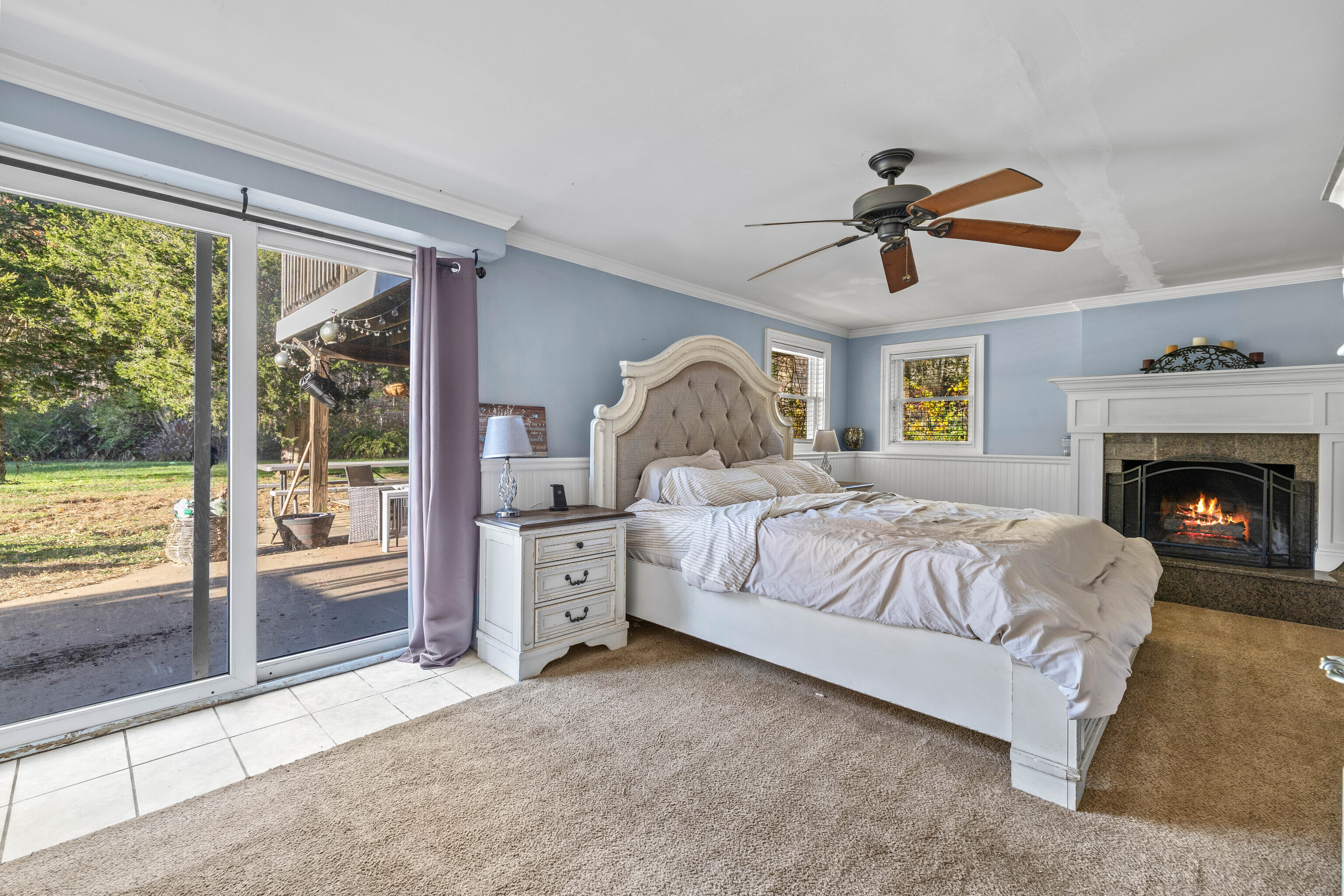 4 Van Dyke Lane Clinton, CT 06413 - Photo 30 of 38 a spacious bedroom with a large bed and a chandelier