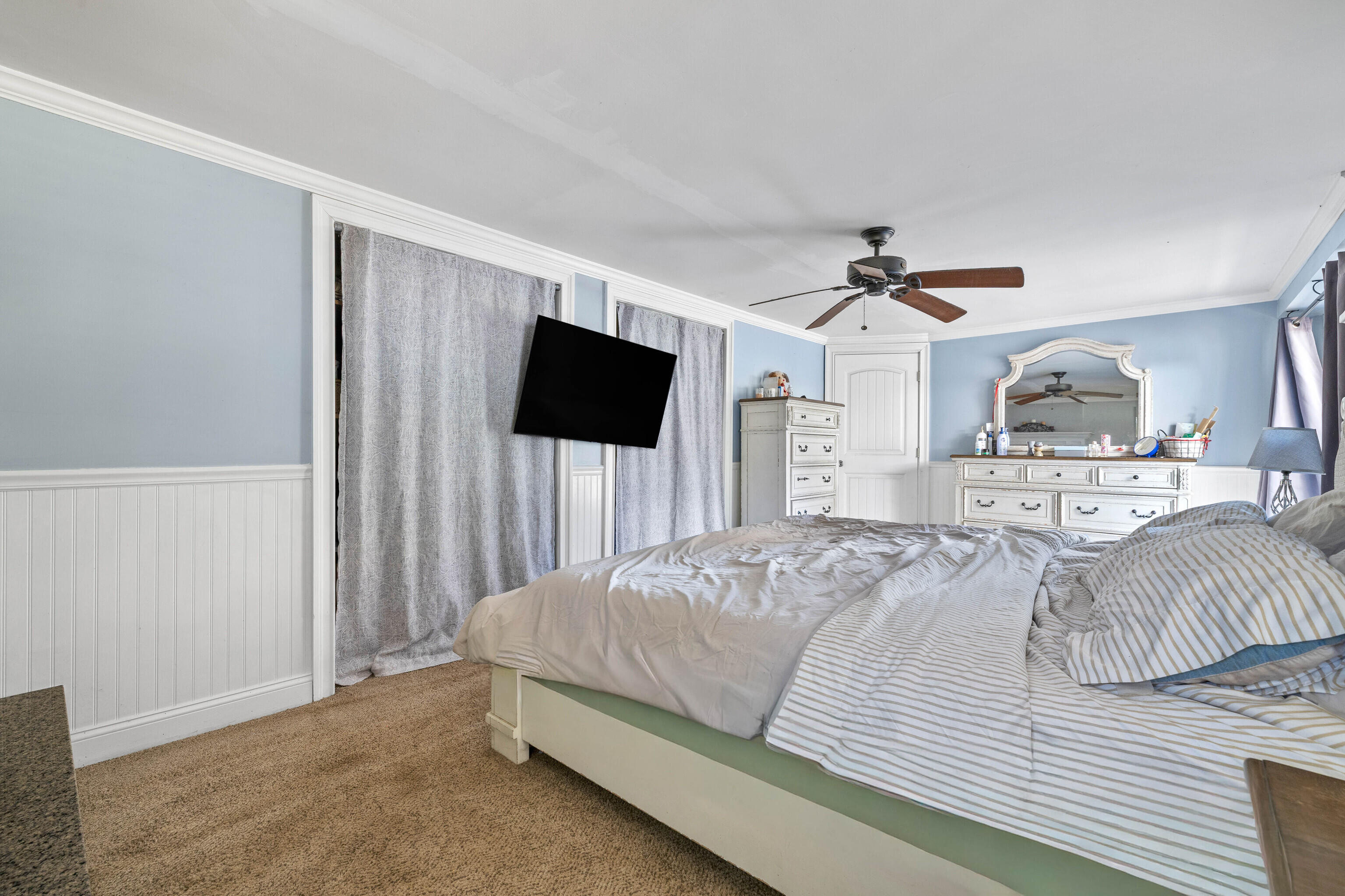 4 Van Dyke Lane Clinton, CT 06413 - Photo 33 of 38 a spacious bedroom with a bed and a flat screen tv