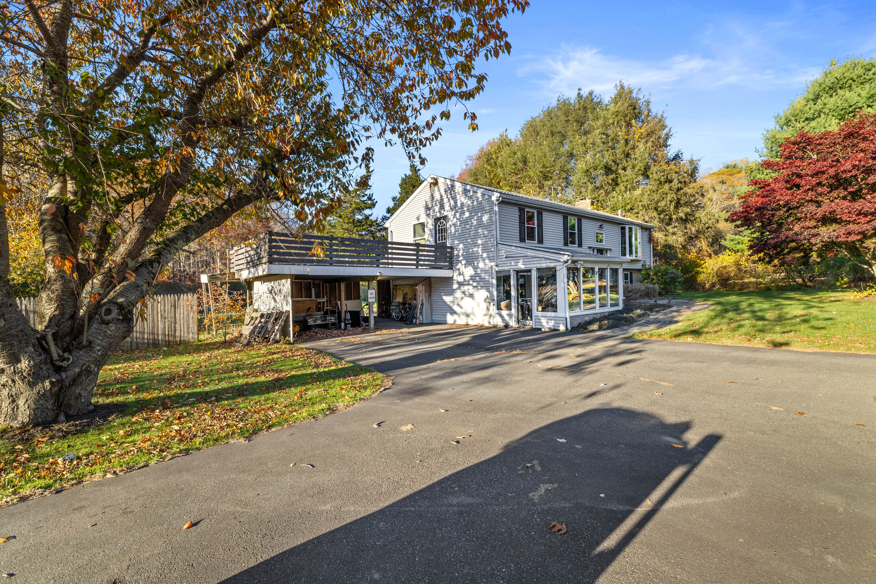 4 Van Dyke Lane Clinton, CT 06413 - Photo 4 of 38 a front view of a house with a garden