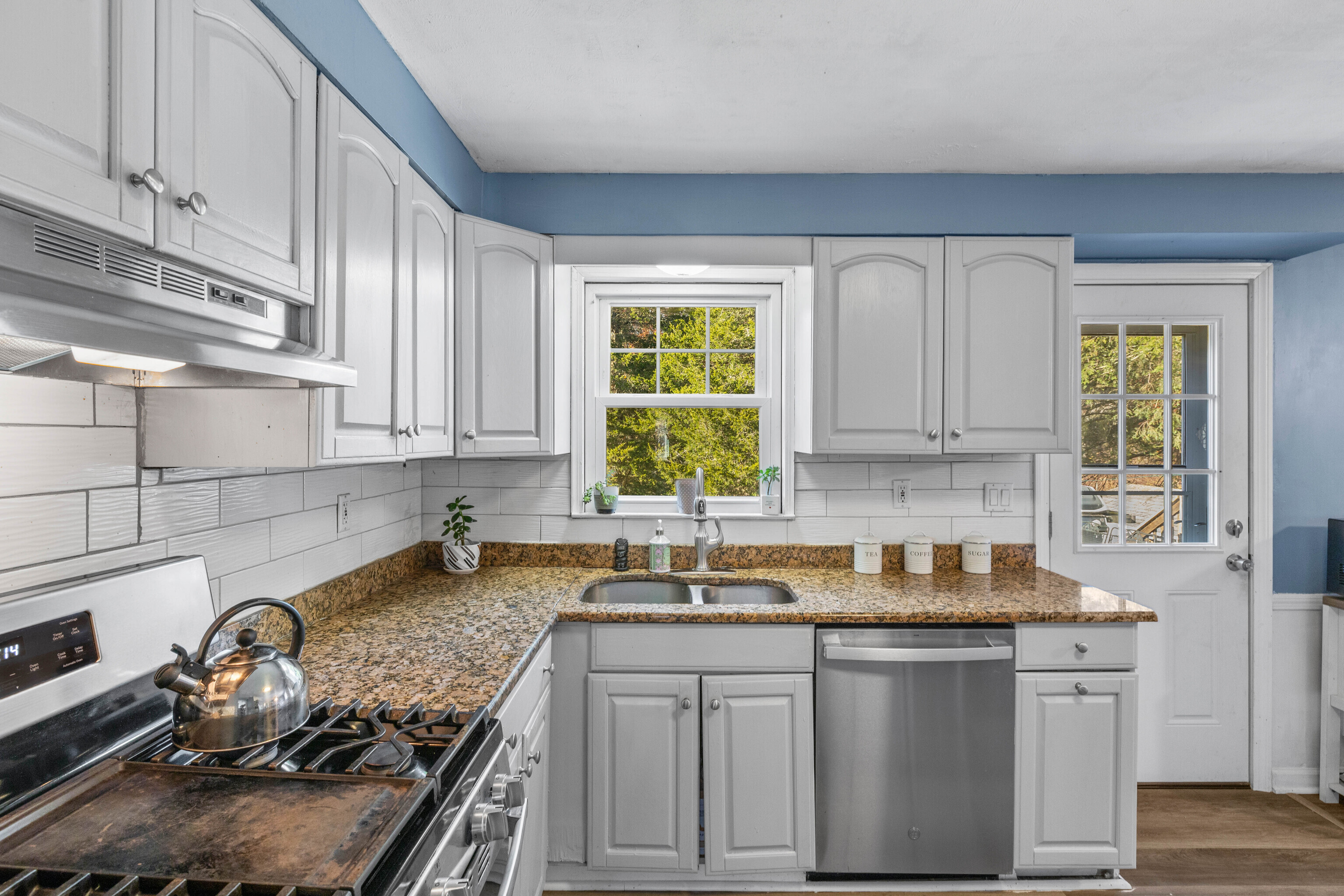 4 Van Dyke Lane Clinton, CT 06413 - Photo 9 of 38 a kitchen with a sink stove top oven and cabinets