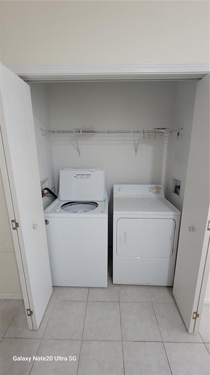 4936 Marina Palms Drive Port Richey, FL 34668 - Photo 13 of 19 a utility room with dryer and washer