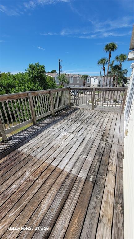 4936 Marina Palms Drive Port Richey, FL 34668 - Photo 18 of 19 a view of a balcony with wooden floor