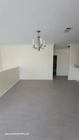 a view of kitchen appliances with cabinets