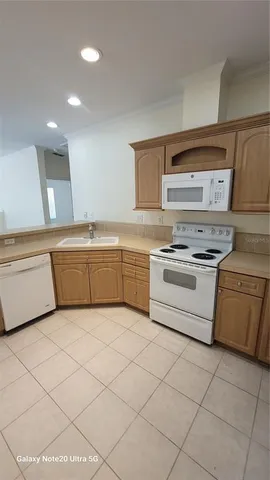 a view of a livingroom with furniture and chandelier