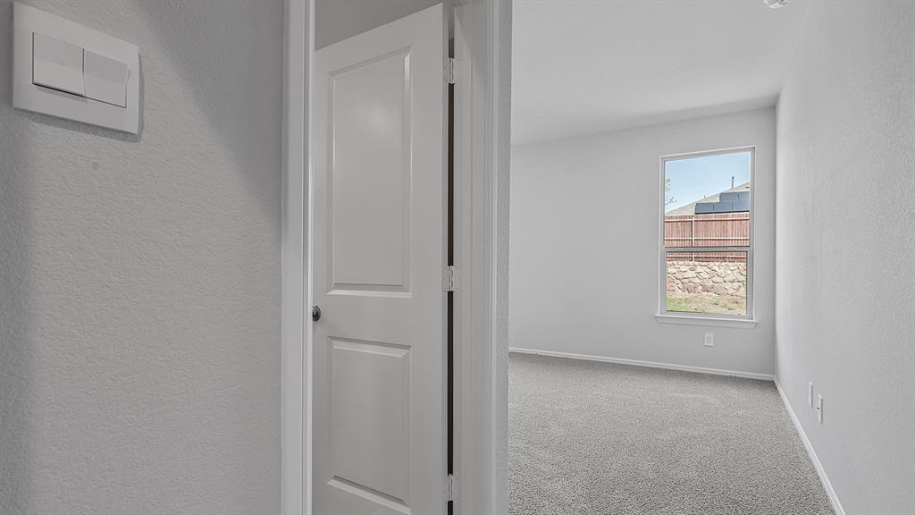 140 Trinity Street Grandview, TX 76050 - Photo 16 of 39 a view of an empty room with a window