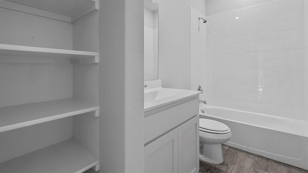 140 Trinity Street Grandview, TX 76050 - Photo 27 of 39 a bathroom with a toilet and a bathtub