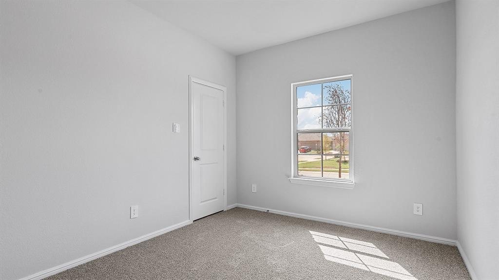 140 Trinity Street Grandview, TX 76050 - Photo 30 of 39 an empty room with windows