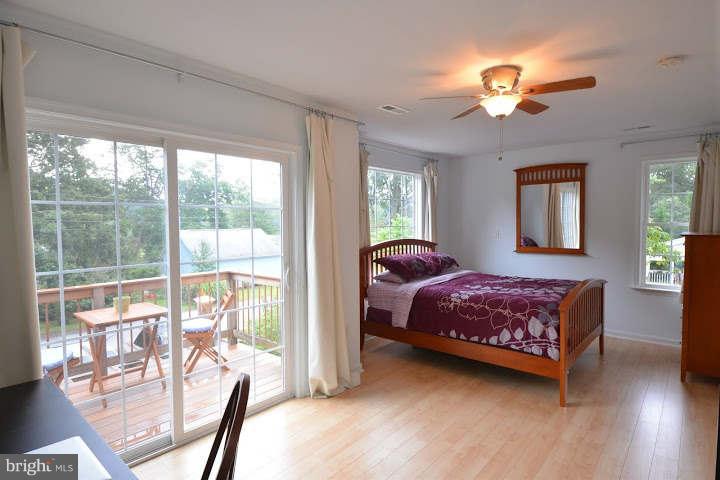 558 Riverside Drive Pasadena, MD 21122 - Photo 14 of 30 Master Bedroom & Deck