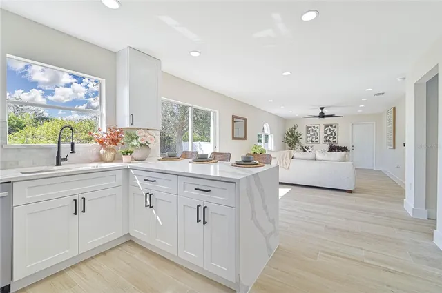 a spacious bathroom with a double vanity sink and a window