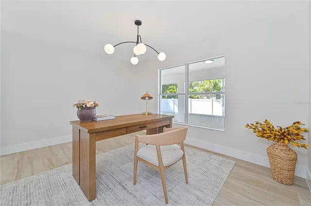 a view of a dining room with furniture window and outside view