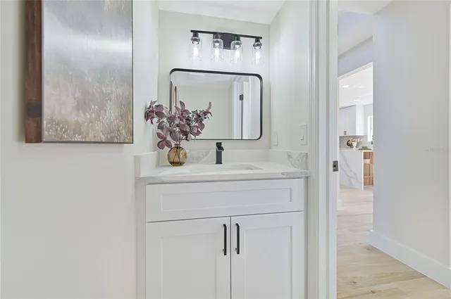 a bathroom with a sink and mirror