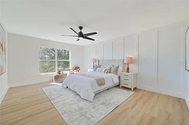 a spacious bedroom with a bed and window