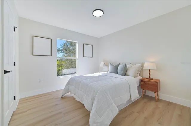 a bathroom with a granite countertop sink a toilet and a bathtub