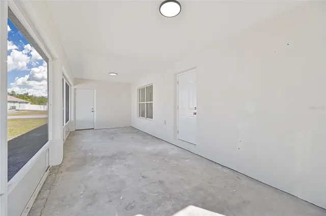 a front view of a house with a garden and yard