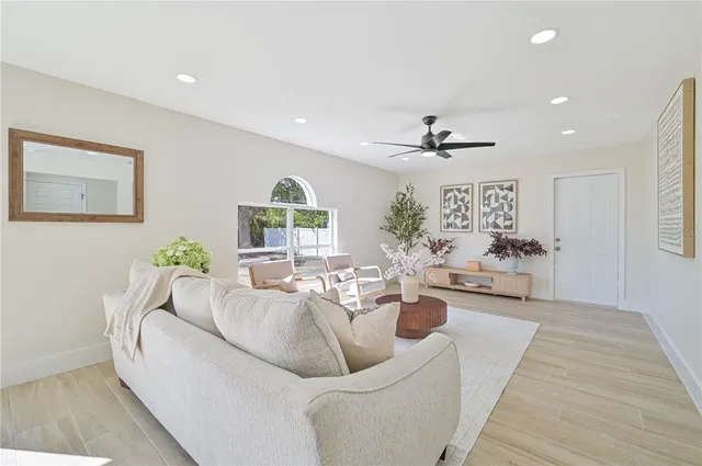 a living room with furniture and a large window