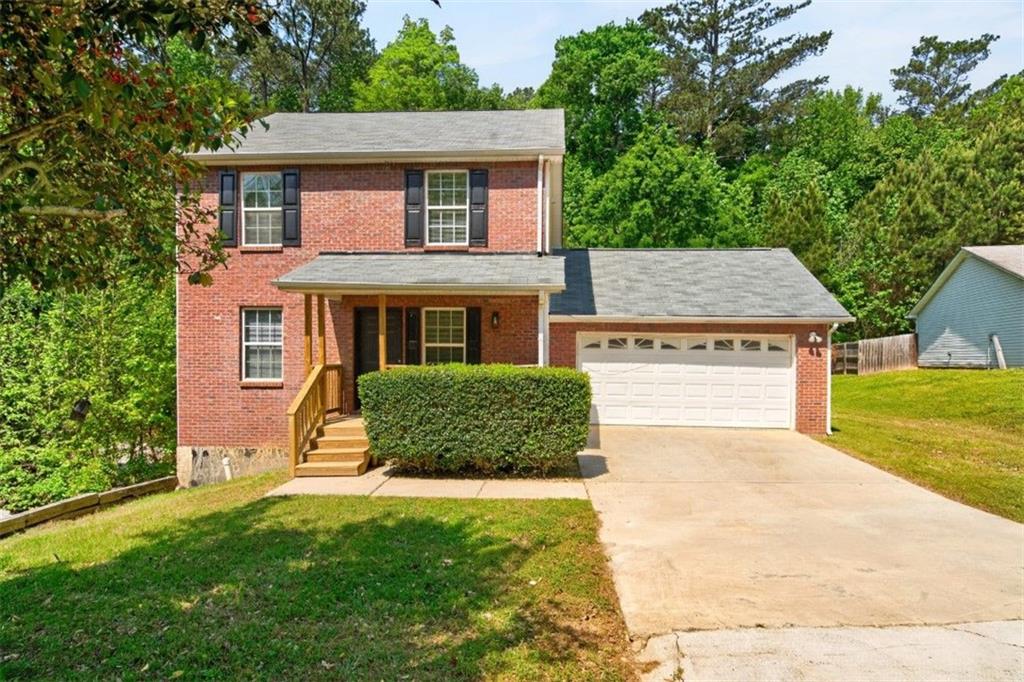 1424 Steam Engine Way Northeast Conyers, GA 30013 - Photo 1 of 32 front view of a house with a yard