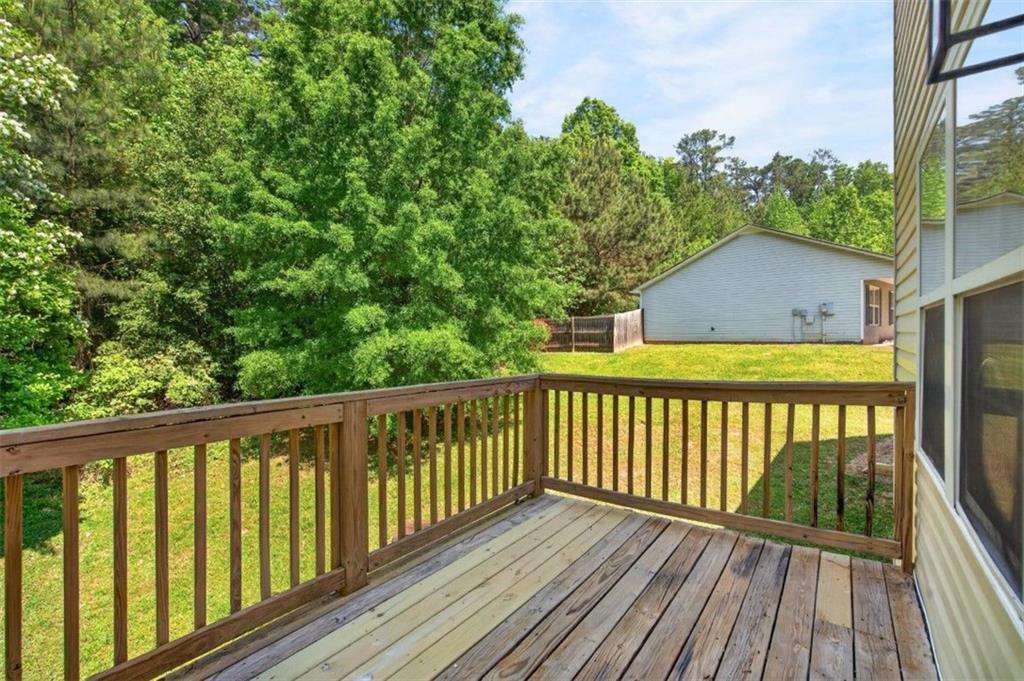 1424 Steam Engine Way Northeast Conyers, GA 30013 - Photo 27 of 32 a view of balcony with wooden floor