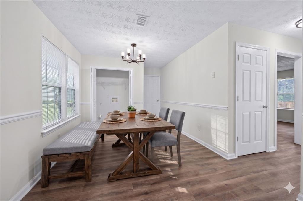 1424 Steam Engine Way Northeast Conyers, GA 30013 - Photo 5 of 32 a view of a dining room with furniture and window