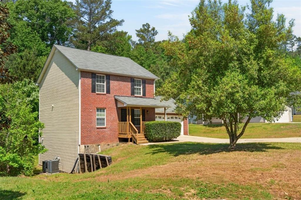 1424 Steam Engine Way Northeast Conyers, GA 30013 - Photo 7 of 32 a view of a house with a yard