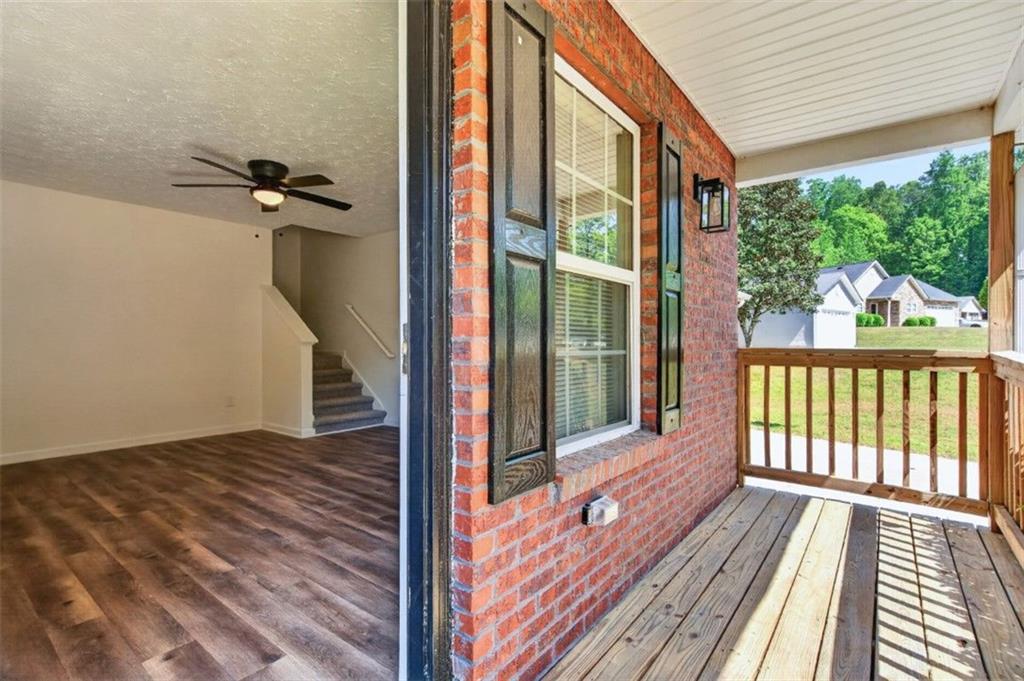 1424 Steam Engine Way Northeast Conyers, GA 30013 - Photo 8 of 32 a view of a balcony with wooden floor