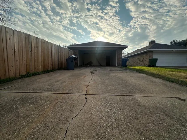 a view of backyard and garage