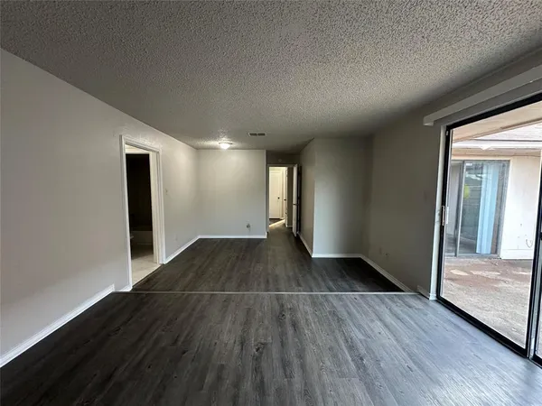 a view of storage and utility room with wooden floor