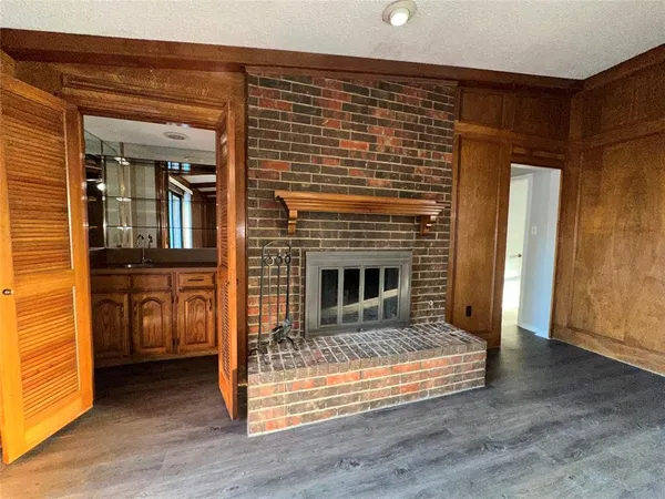 a kitchen with stainless steel appliances granite countertop a stove refrigerator sink and cabinets