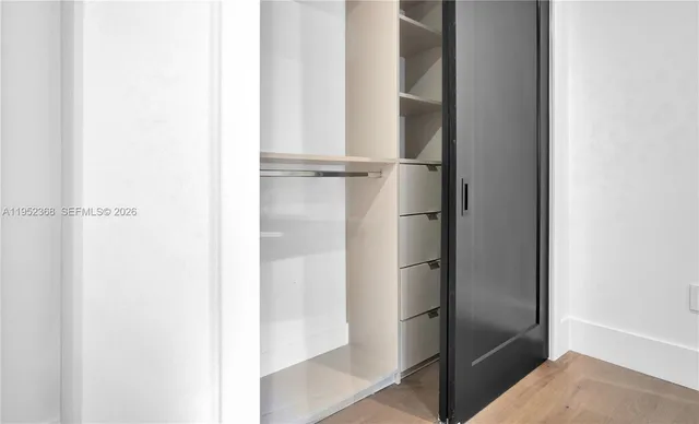 a bathroom with a glass shower door