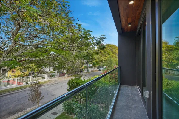 a view of a balcony with an outdoor space