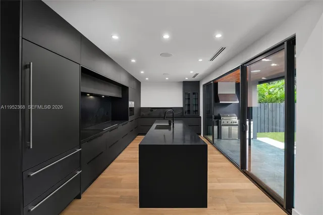 a lobby with a couch and a glass door