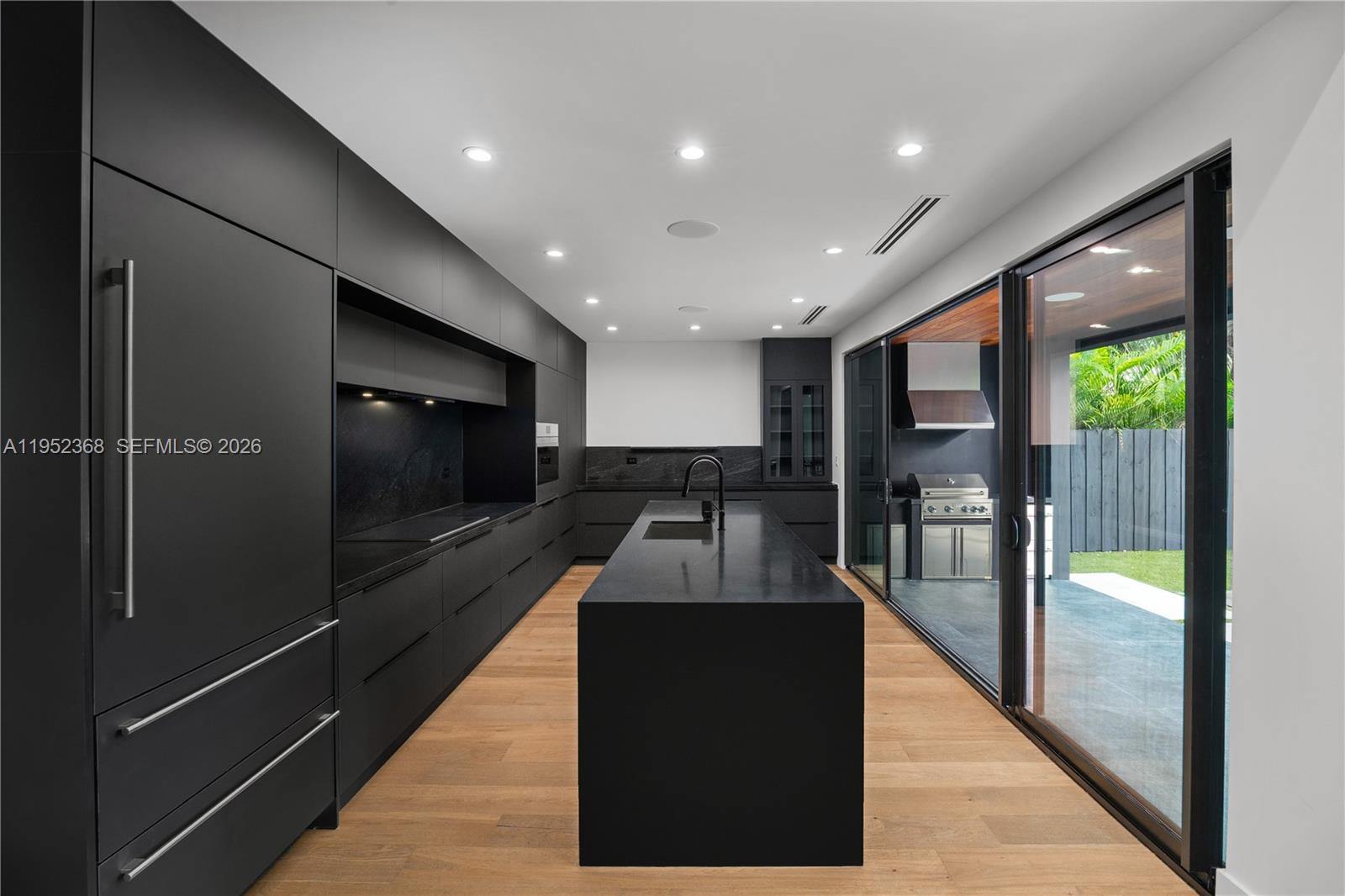 30 Northeast 50th Street Miami, FL 33137 - Photo 10 of 35 a lobby with a couch and a glass door