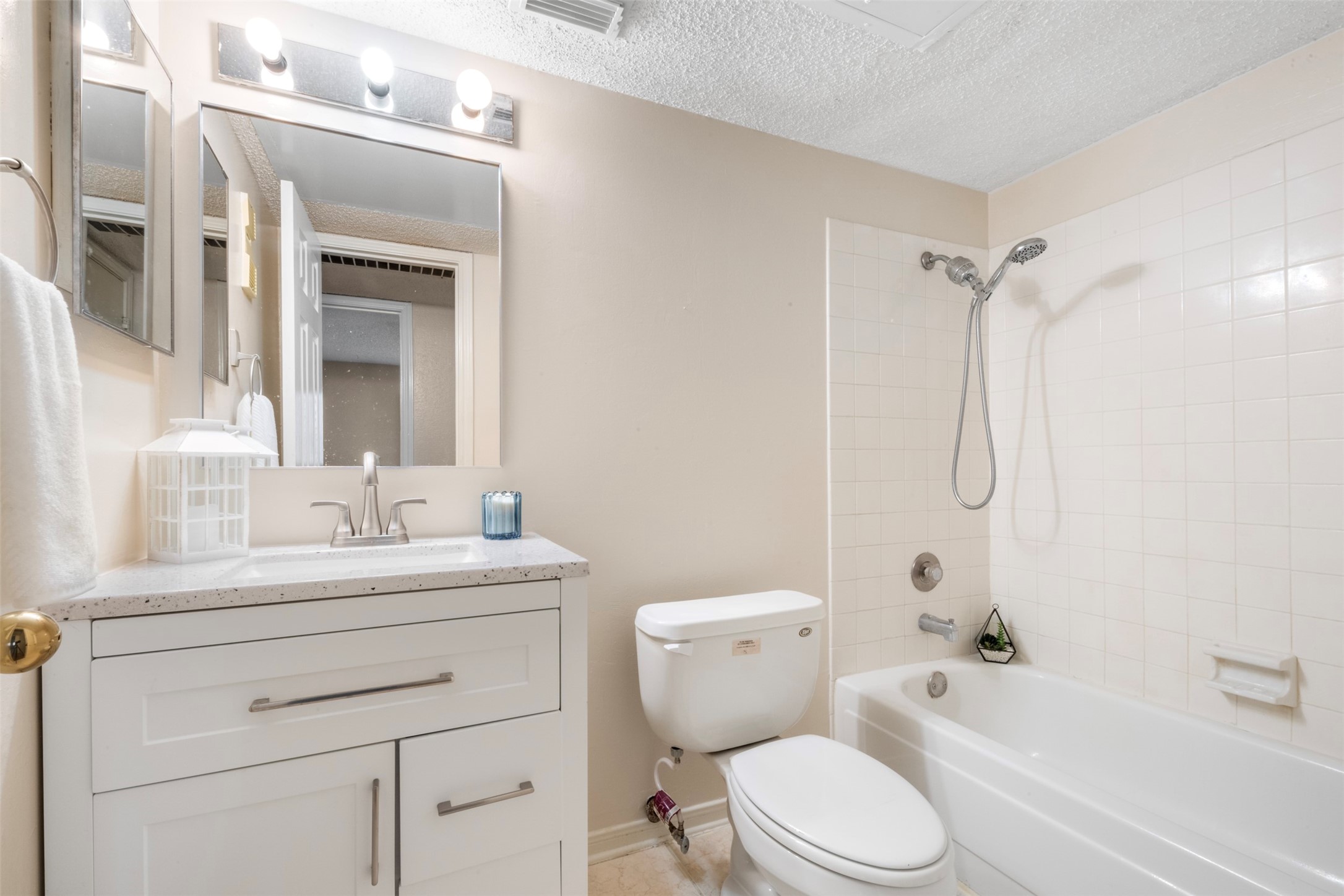 6701 Sands Point Drive, Unit 61 Houston, TX 77074 - Photo 15 of 20 a bathroom with a toilet sink vanity tub and shower