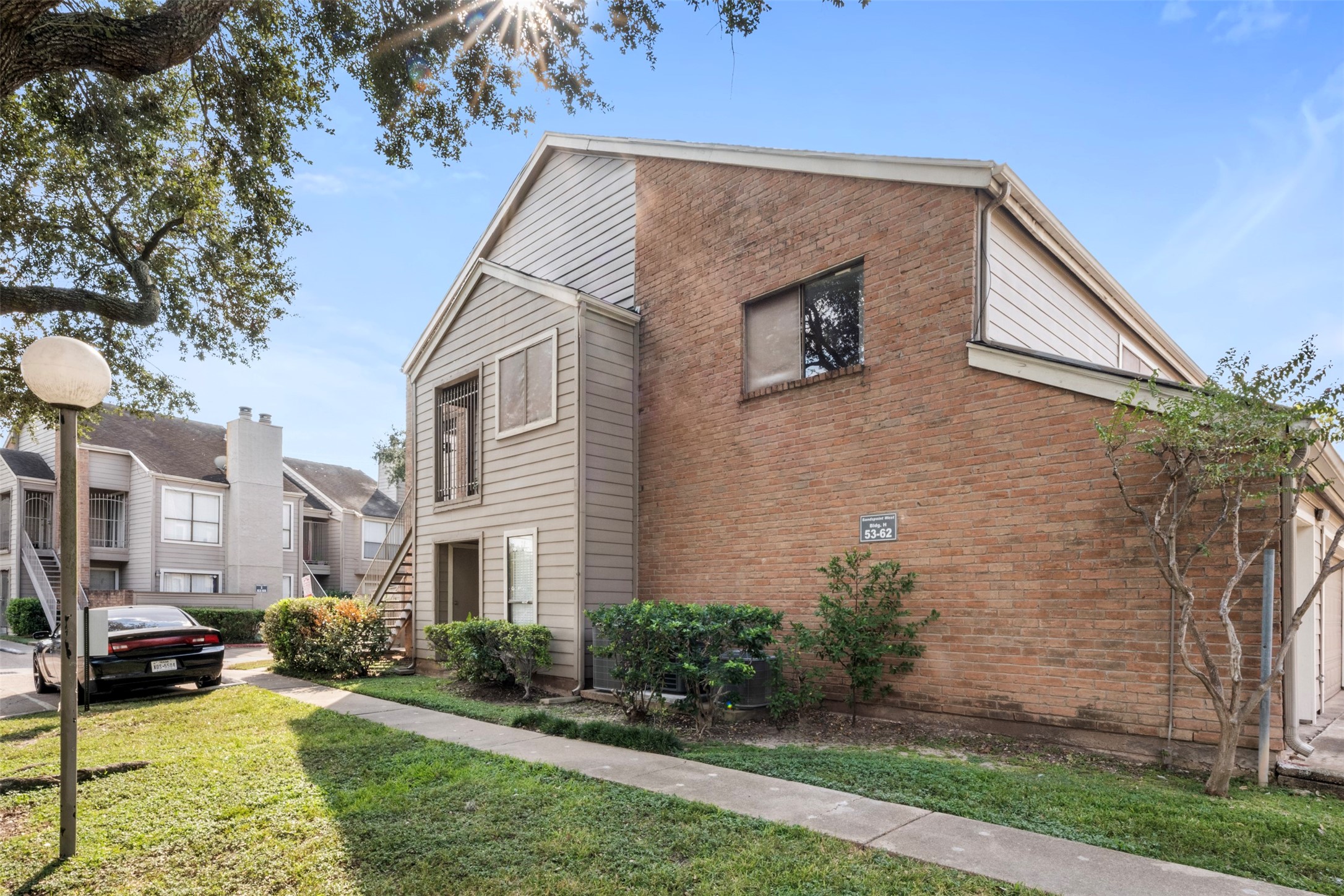 6701 Sands Point Drive, Unit 61 Houston, TX 77074 - Photo 2 of 20 a view of a house with a yard