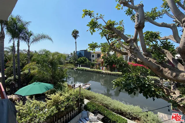 a view of a lake with a house in the background