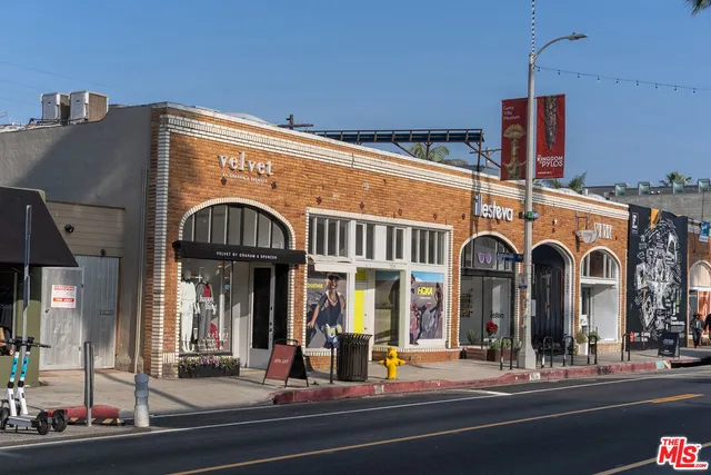 a view of a building with car parked