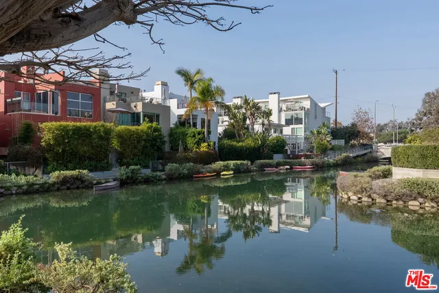 a view of residential house with outdoor space and lake view