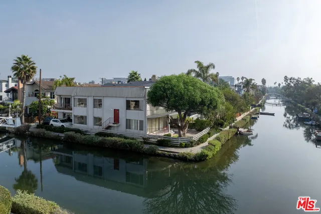 a house with river in front of it