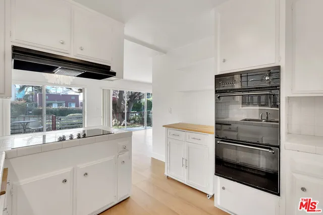 a kitchen with stainless steel appliances a stove and a refrigerator