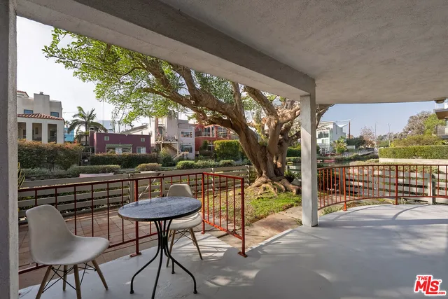 a view of a chairs and table in the terrace